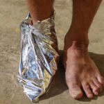 If you see someone’s feet wrapped in aluminum foil, here’s what it could mean