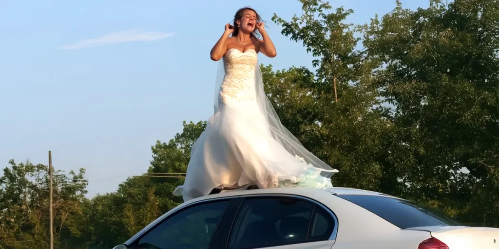 I Stepped Outside One Morning and Saw a Woman in a Wedding Dress on My Husband’s Car Roof